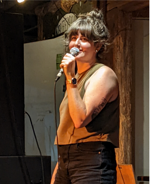 Lianna doing comedy at Buzz Mill, June 2022